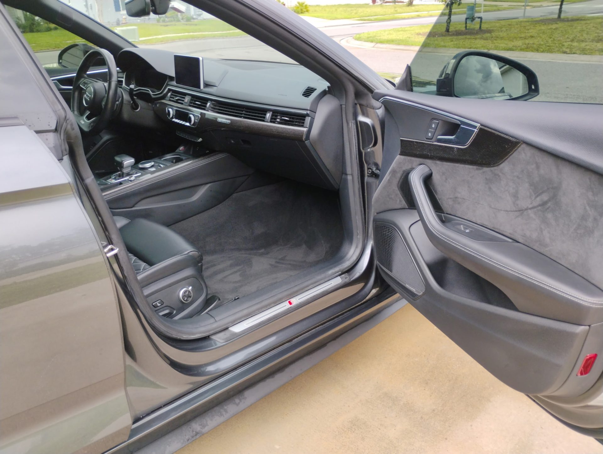 Car interior with open door

