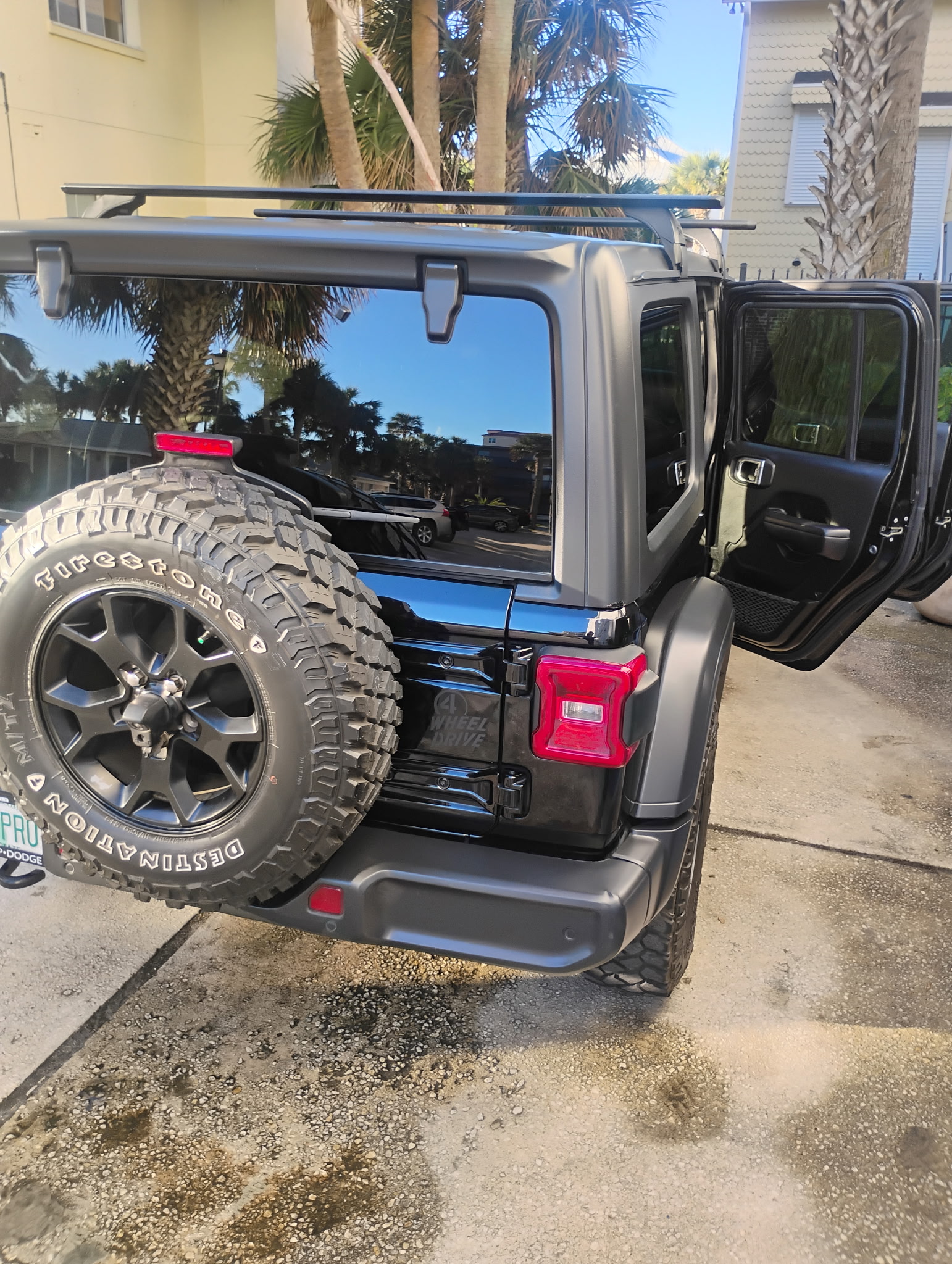Black Jeep with open door

